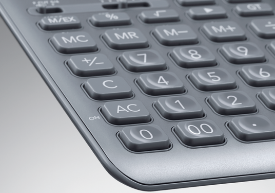 Close-up of a sleek, metallic gray desktop calculator with ergonomic, rounded keys and a slim, modern design.