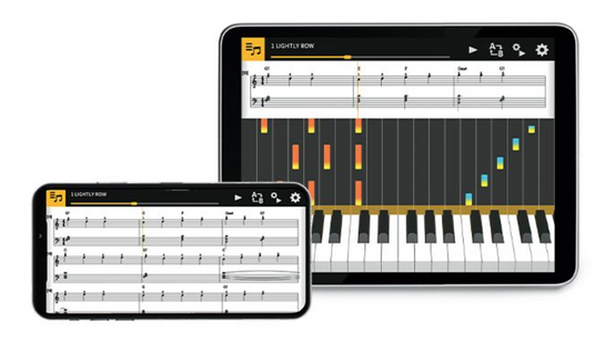 Tablet and smartphone displaying a piano learning app with musical notation and a visual keyboard interface.