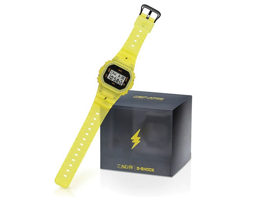 Translucent neon yellow G-Shock digital watch with a matching branded display box featuring a lightning bolt logo.