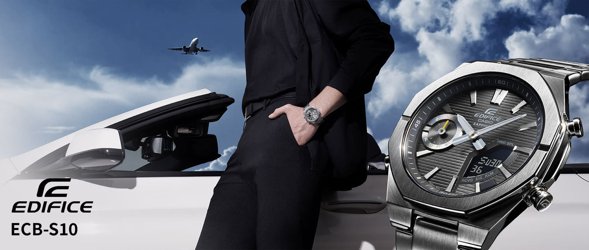 Man in black clothing leaning against a white car with a Casio Edifice ECB-S10 watch and airplane in the sky.