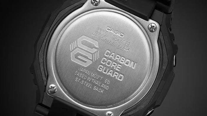Stainless steel case back of a black Casio G-Shock GA-2100 watch featuring Carbon Core Guard branding.