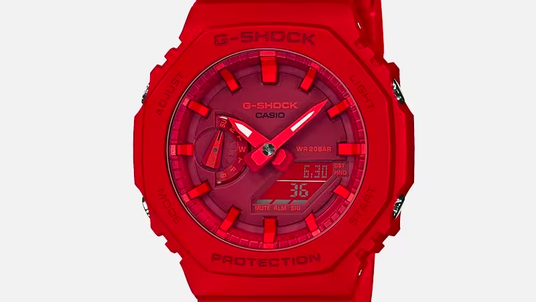 Bright red Casio G-Shock watch with an analog-digital display and octagonal resin bezel.