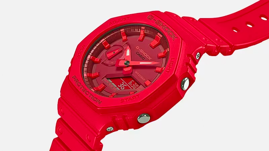 Bright red Casio G-Shock watch with an octagonal bezel, analog-digital display, and durable resin strap.