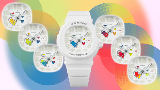 White Casio Baby-G watch featuring a colorful heart-themed dial against a vibrant, multi-colored circular background.