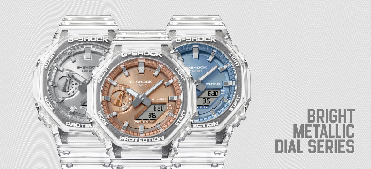 Three G-SHOCK watches with transparent resin bands and metallic silver, copper, and blue analog-digital dials.