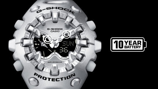 Silver Casio G-Shock watch with a rugged, metallic bezel, analog-digital display, and a 10-year battery icon.