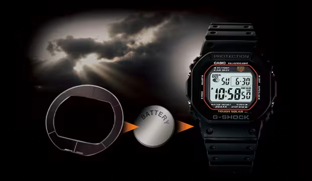 Black Casio G-Shock digital watch with solar charging technology replacing a traditional battery against a cloudy sky.